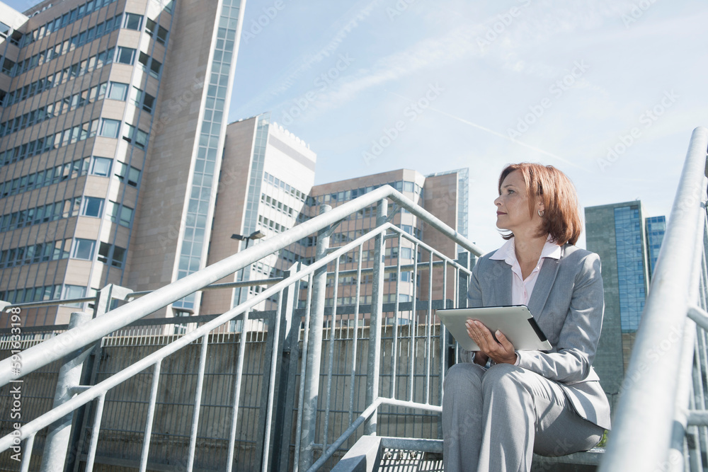 Businesswoman using Tablet PC, Niederrad, Frankfurt, Germany Businesswoman using Tablet PC, Niederrad, Frankfurt, Germany