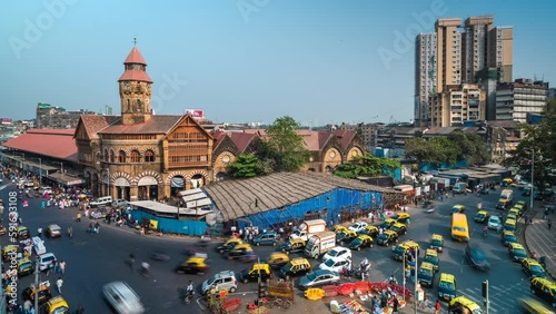 Time lapse view of traffic around historic landmark Crawford Market in Mumbai, Maharashtra, India.  photo