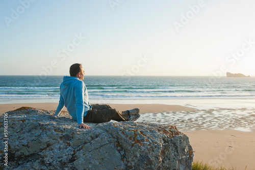Man Looking into the Distance at the Beach, Camaret-sur-Mer, Crozon Peninsula, Finistere, Brittany, France