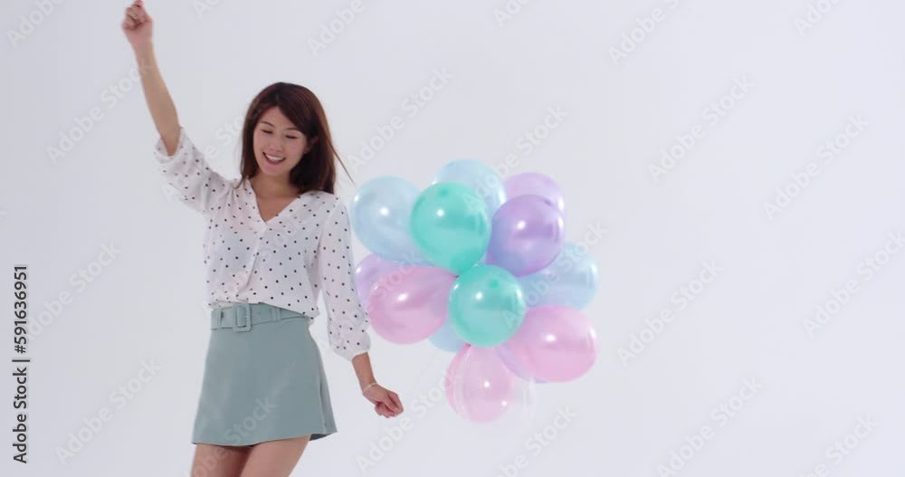 Cheerful young woman holding balloons,4K Cheerful young woman holding balloons,4K