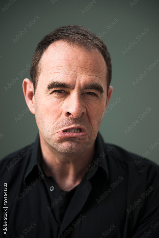 Head and Shoulders Portrait of Upset Mature Man Head and Shoulders Portrait of Upset Mature Man