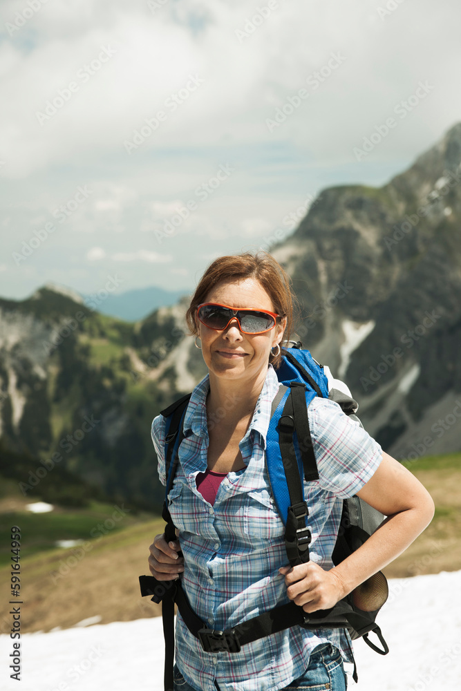 Portrait of mature woman hiking in mountains, Tannheim Valley, Austria Portrait of mature woman hiking in mountains, Tannheim Valley, Austria
