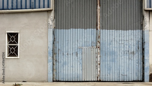 worn metal industry warehouse door © Esteve