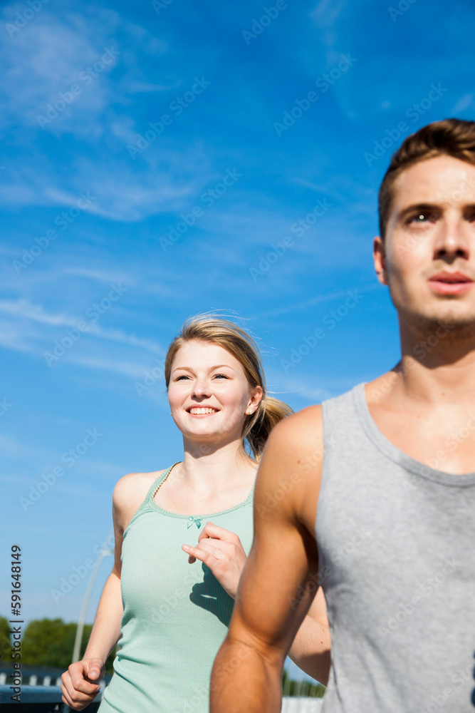 Young Couple Running, Worms, Rhineland-Palatinate, Germany Young Couple Running, Worms, Rhineland-Palatinate, Germany