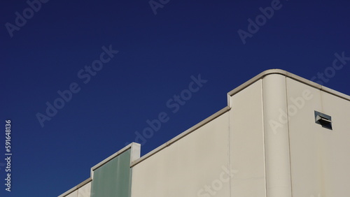 industrial building facade against blue sky