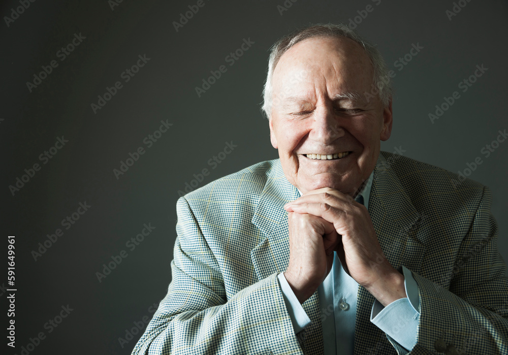 Portrait of Seniior Man Smiling with Eyes Closed, Studio Shot Portrait of Seniior Man Smiling with Eyes Closed, Studio Shot