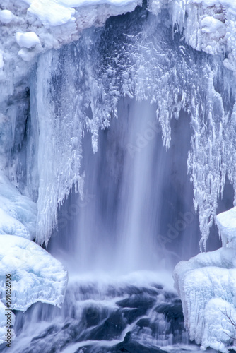 Icy crust formation over the Undine Falls in winter; Yellowstone National Park, United states of America