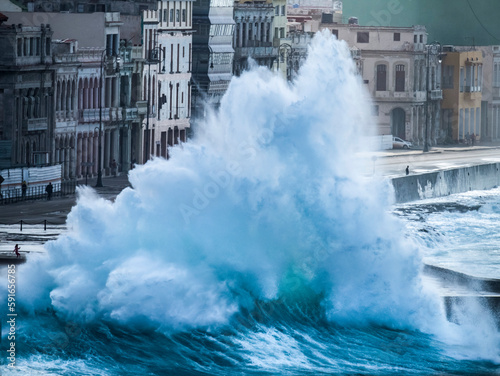 The north wind blows a large wave on to the Malecon in Havana, Cuba; Havana, Cuba photo