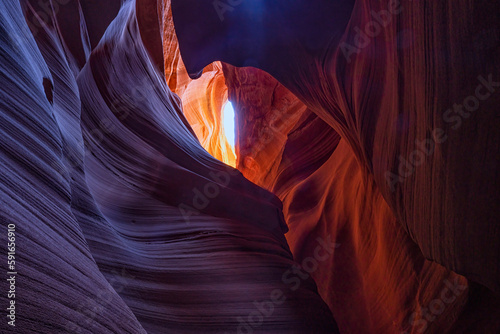 Slot canyon near Page, Arizona. The wind and water create amazing striations in the sandstone in a stunning example of erosion; Page, Arizona, United States of America