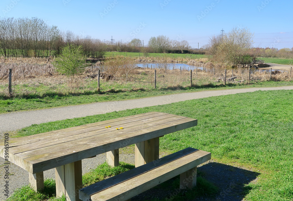 A picnic table overlooking Henhurst Lake in the North Kent countryside A picnic table overlooking Henhurst Lake in the North Kent countryside
