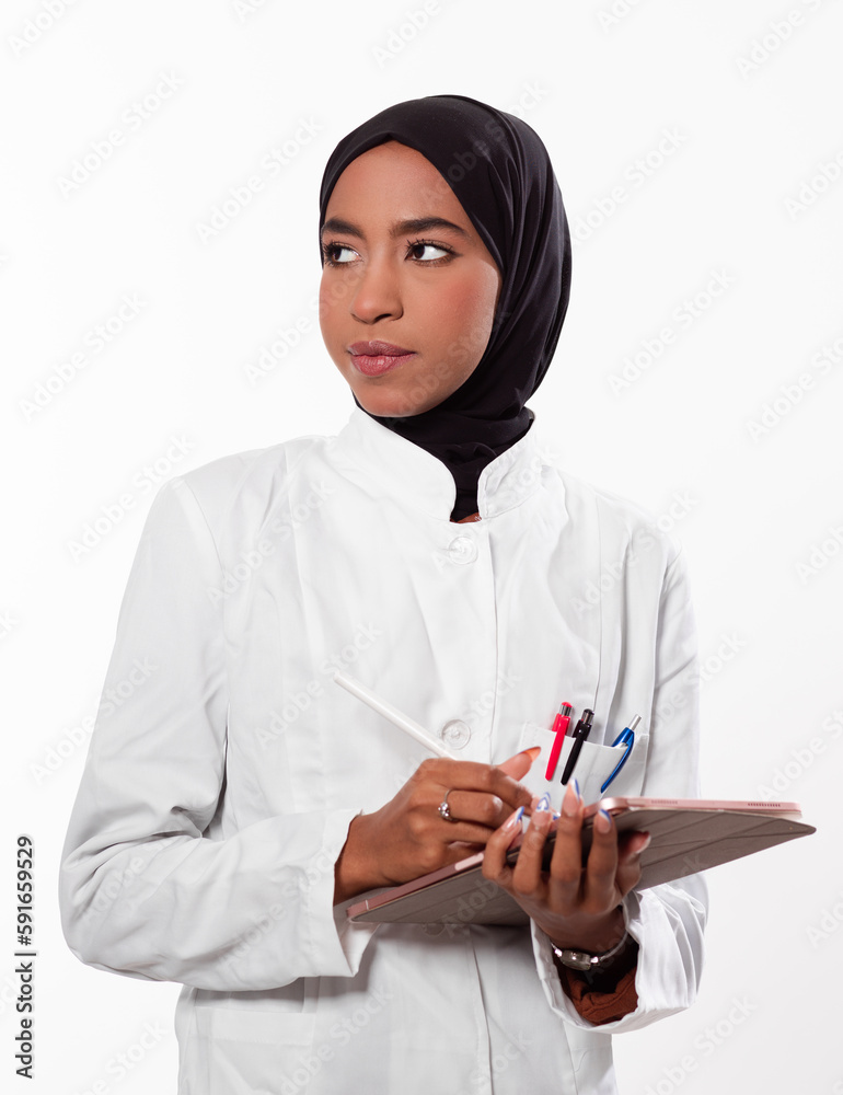 Portrait of muslim female nurse. Authentic Confident Middle Eastern Healthcare Worker. Middle age senior Arab nurse woman wearing hijab over isolated background. Portrait of muslim female nurse. Authentic Confident Middle Eastern Healthcare Worker. Middle age senior Arab nurse woman wearing hijab over isolated background.