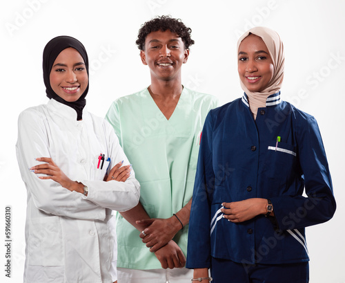 Photography Closeup front view of group of mixed age doctors and nurses standing side by side and looking at the camera