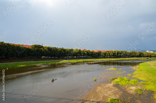 View of Uzh river and longest european linden alley in the central part of the city of Uzhhorod, Ukraine photo