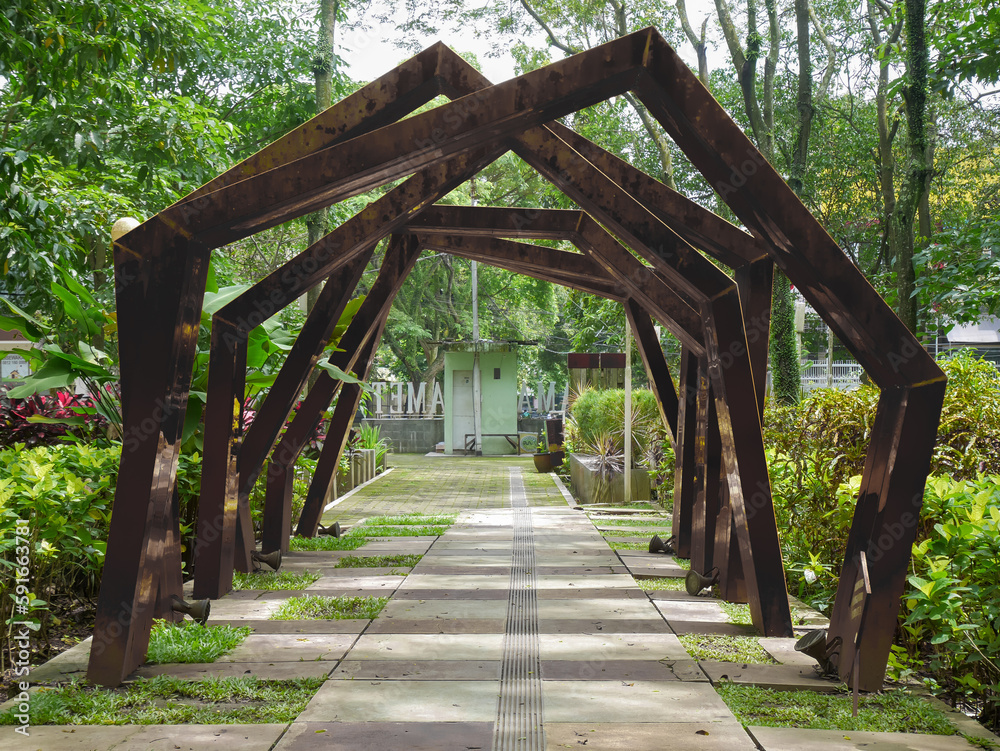 a unique construction with an abstract concept that is shaped like an alley on a path in a park a unique construction with an abstract concept that is shaped like an alley on a path in a park