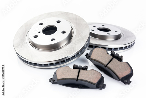 Car brake disc and pads on white background photo