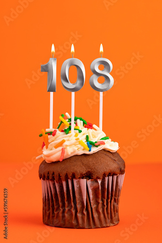 Birthday cake with candle number 108 - Orange foamy background