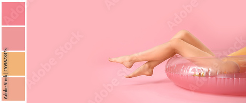 Young woman in swimsuit and with inflatable ring on pink background. Different color patterns