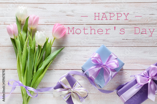 Beautiful greeting card for Happy Mother's Day on light wooden background