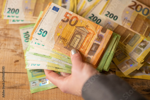  Recalculation of money. Counting euro banknotes.Hands recalculate banknotes.