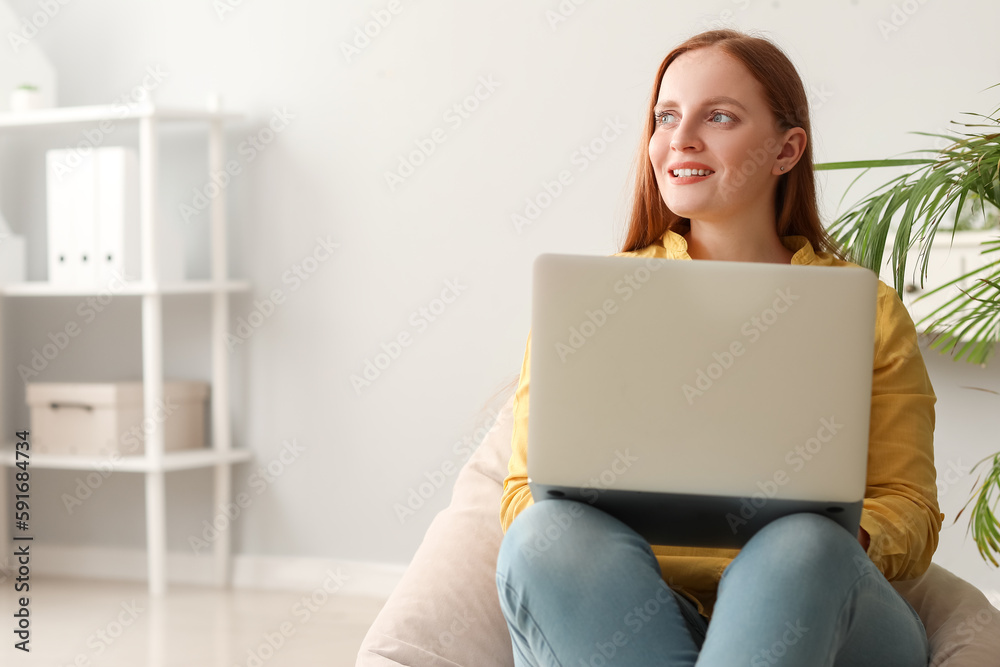 Female programmer working with laptop in office Female programmer working with laptop in office