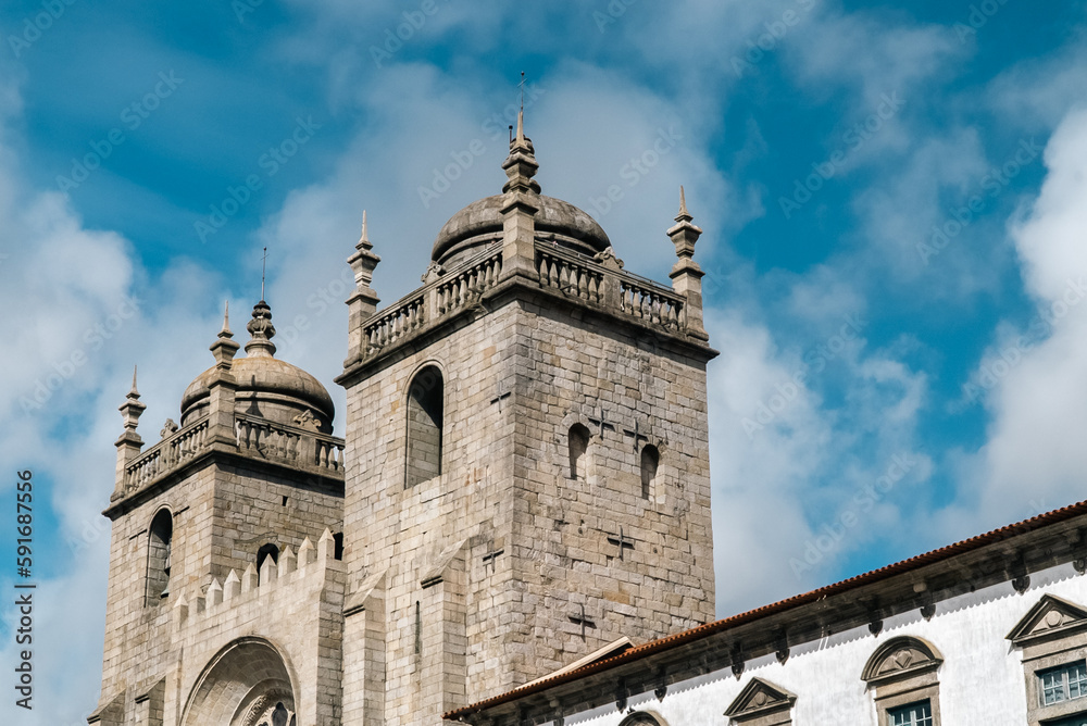 Oporto, Portugal. April 12 , 2022: Pelourinho and Porto Cathedral with facade and blue sky.