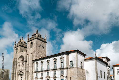 Fototapeta Naklejka Na Ścianę i Meble -  Oporto, Portugal. April 12 , 2022: Pelourinho and Porto Cathedral with facade and blue sky.