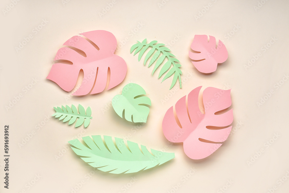 Paper tropical leaves on beige background Paper tropical leaves on beige background