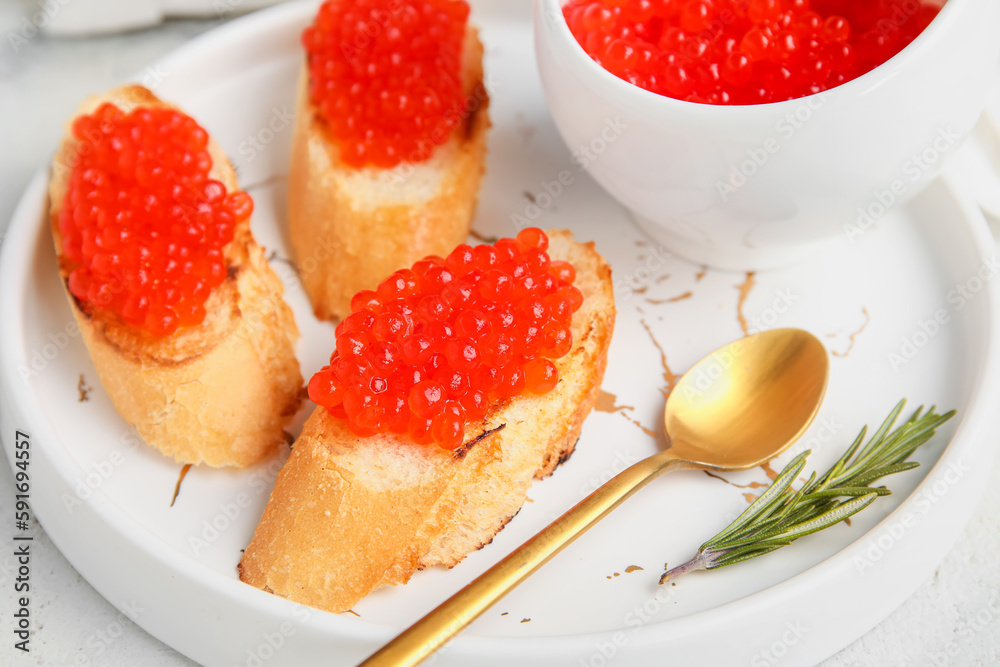 Tasty bruschettas with red caviar on grunge background Tasty bruschettas with red caviar on grunge background
