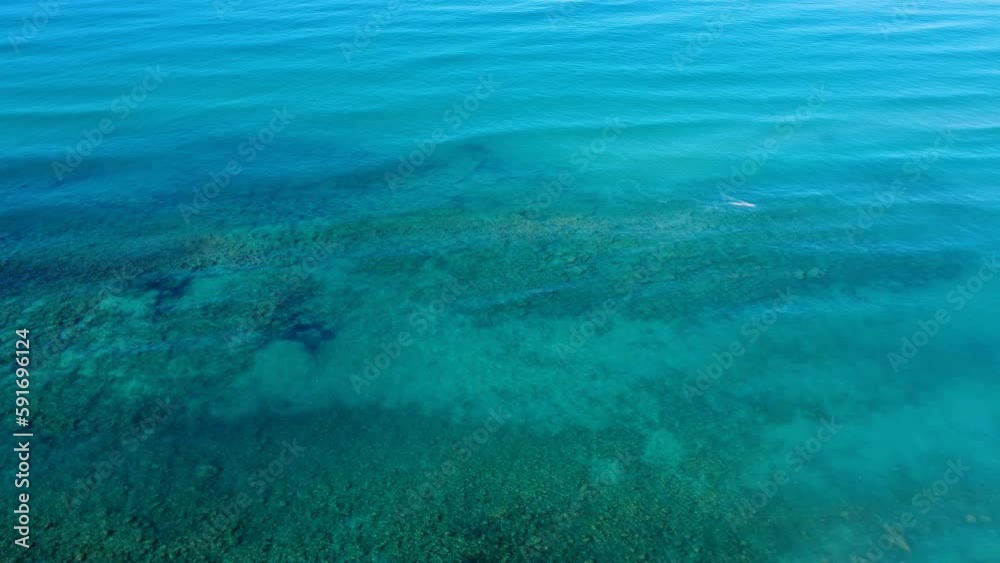Cinematic Aerial drone view of crystal turquoise sea water surface over uncontaminated beach,nature 4k Cinematic Aerial drone view of crystal turquoise sea water surface over uncontaminated beach,nature 4k