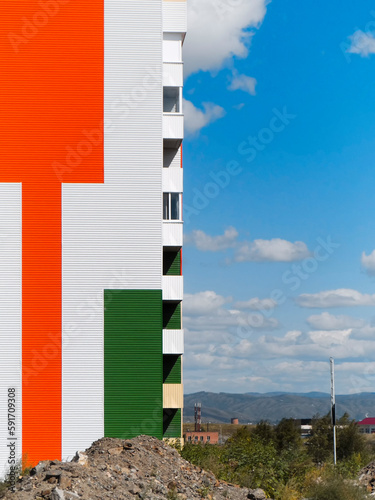 Gable end of multistory apartment house. Urban landscape. Contemporary architecture. Ust-Kamenogorsk, kz. 2021.