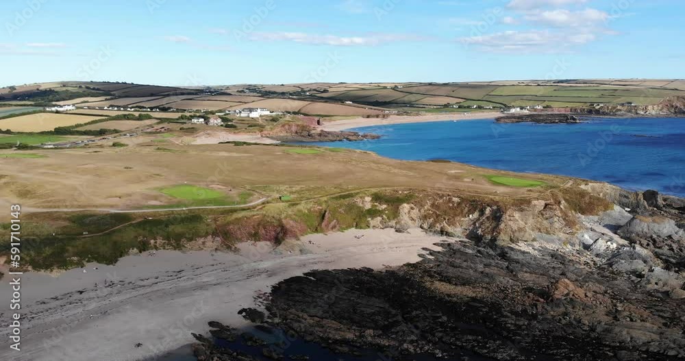 Aerial pan of Thurlestone, an English village. Captivating view from ocean to land. Aerial pan of Thurlestone, an English village. Captivating view from ocean to land.
