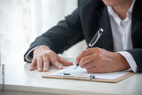 Close up manager businessman hands sign contract working meeting. Asian business man using pen signing on new contract to starting projects in conference room. Business agreement concepts.