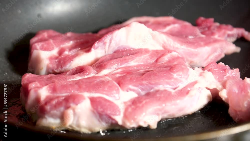 Searing fillet steaks in a frying pan. High quality 4k footage Searing fillet steaks in a frying pan. High quality 4k footage