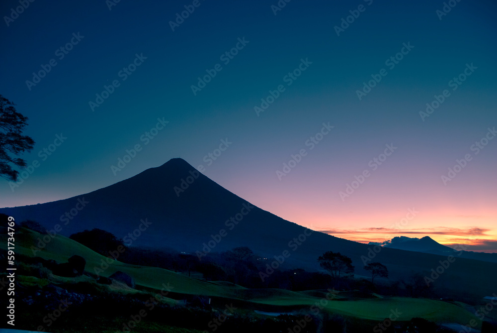 Panoramic view of volcano called agua at sunrise in Guatemala, central america, volcanic landscape, forest adventure.