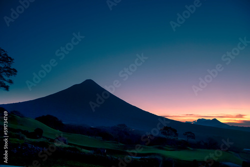 Panoramic view of volcano called agua at sunrise in Guatemala, central america, volcanic landscape, forest adventure.