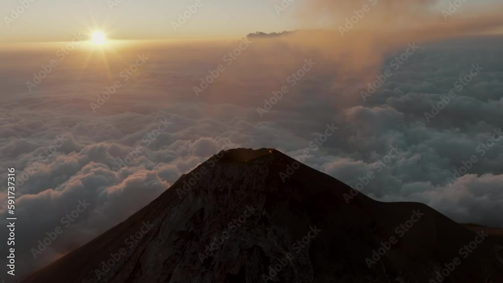 Scenic Tranquility Of Fuego Volcano At Sunset In Guatemala. Aerial Drone Shot