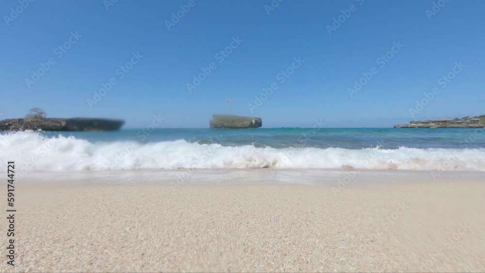 view from the shore in rio san juan dominican republic, waves hitting the go pro on a sunny day. view from the shore in rio san juan dominican republic, waves hitting the go pro on a sunny day.