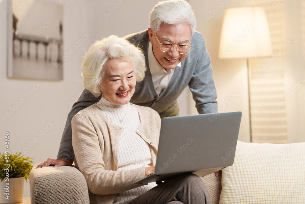 Elderly couple using laptops Elderly couple using laptops