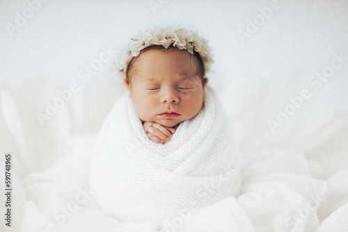 Newborn baby girl in flower
