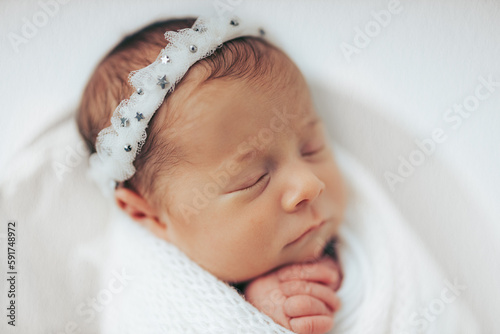 Newborn baby girl closeup portrait