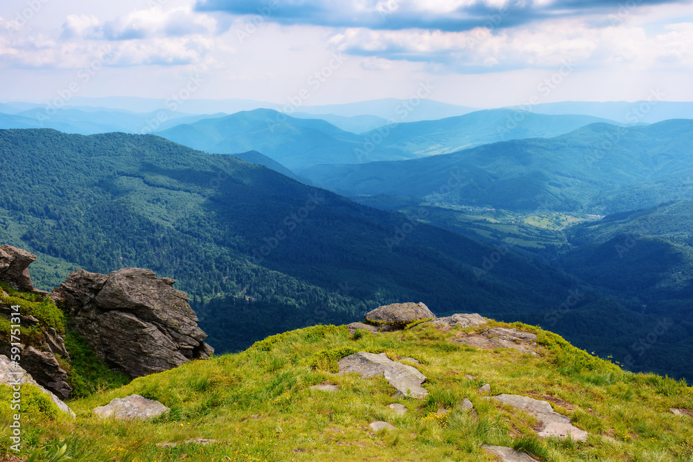 carpathian watershed ridge. stones and boulders on the green grassy hills. hot summer day carpathian watershed ridge. stones and boulders on the green grassy hills. hot summer day
