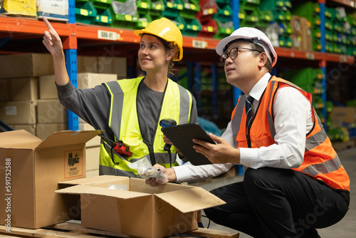 Warehouse worker tag and label products with a handheld scanner to prepare and complete orders. Verifying all products are safely and securely packed and labeled for shipment to the correct location.