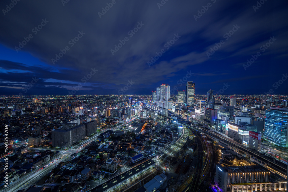 Nagoya station and its vicinity downtown area with high rise buildings at night.