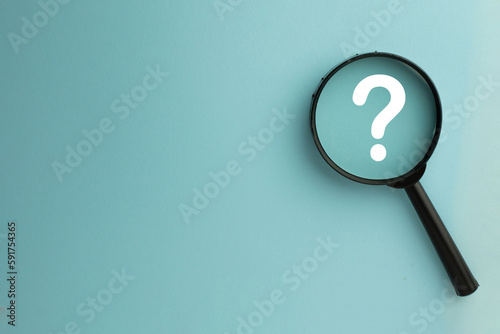Thinking,Creative,Question,Solution,confusion concept.,Magnifying glass focus on Question mark icon over blue sky background with copyspace for put your text or logo