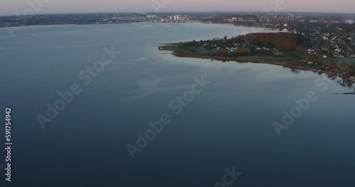 AERIAL: Drone footage of sunrise over a lake in Denmark. photo