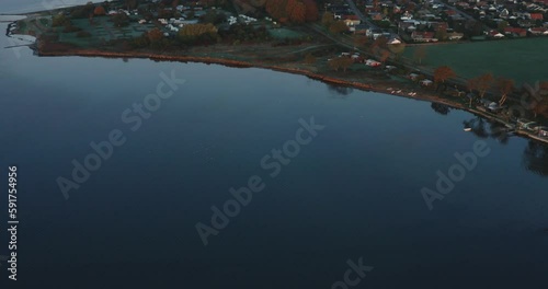 AERIAL: Drone footage of sunrise over a lake in Denmark. photo