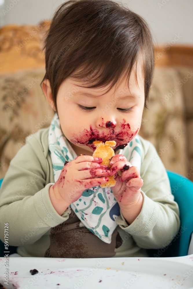 young child enjoying eating marmalade / jam / jelly young child enjoying eating marmalade / jam / jelly