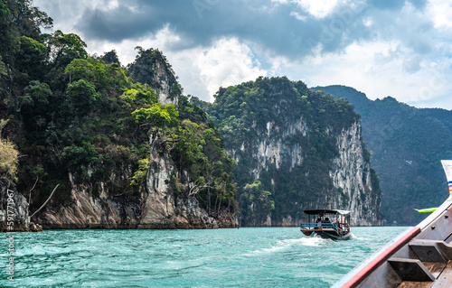 Amazed nature scenic landscape with boat for traveler, Attraction famous landmark tourist travel Khao Sok National Park, Thailand. Long tail boat trip © Celt Studio
