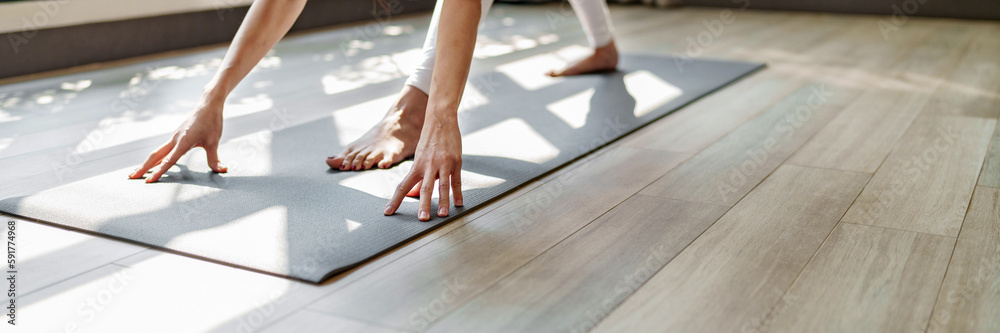 Fitness woman doing yoga exercise stretching on mat yoga, wellbeing lifestyle. - obrazy, fototapety, plakaty 