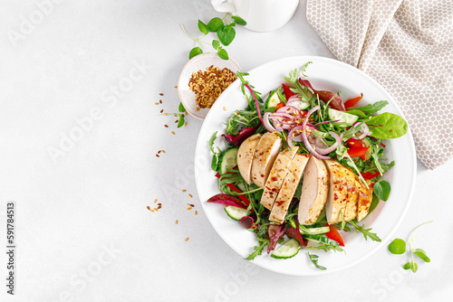 Fotografiet Chicken breast grilled and fresh vegetable salad